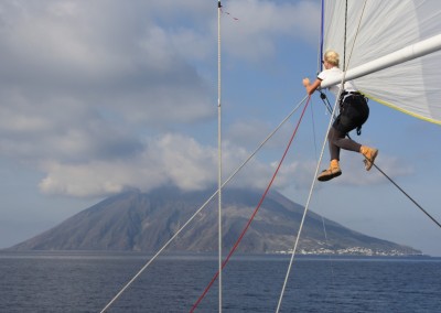 Capstan Sailing's bowgirl is performing a kite peel just off Stromboli. Our favourite photo!